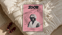 Pink Tyler the Creator IGOR Tracklist framed print styled on a bed with sneakers alongside