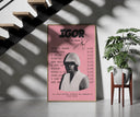 Pink Tyler the Creator IGOR Tracklist framed print on a staircase entryway wall beside a plant