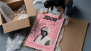 Pink Tyler the Creator IGOR Tracklist framed print being unboxed from protective packaging