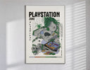 Overgrown PlayStation console with controller poster in a slim frame on a bright wall with soft window light