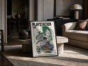 Overgrown PlayStation console with controller print in a black frame leaning on a travertine table in a sunlit lounge