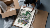 Overgrown PlayStation console with controller framed print being unpacked from protective bubble wrap and a box