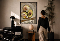 Poached Eggs on Avocado Toast print in a black frame on a sunlit plaster wall, a woman looking on beside a mushroom lamp