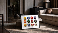 Twelve Pool Balls Solids and Stripes print in a black frame leaning on a rug beside a beige sofa