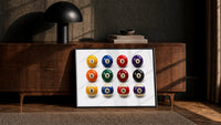 Twelve Pool Balls Solids and Stripes print in a black frame leaning against a walnut sideboard