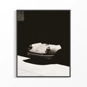 A framed Porsche 911 Classic Front Noir poster showing a vintage white Porsche sports car against dramatic black shadows