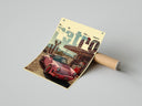 Porsche 911 Retro Gas Station print featuring pink porsche 911 laid out next to brown cardboard shipping tube