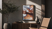 Pouring a Sparkling Drink poster framed above a fluted sideboard beside a potted tree