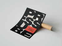 Gently curled Pressure Is a Privilege print beside its protective shipping tube