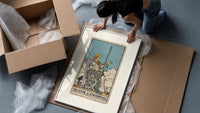 Queen of Swords tarot card framed print being unpacked from protective bubble wrap and a box