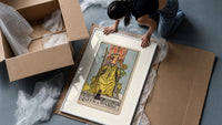 Queen of Wands tarot card framed print being unpacked from protective bubble wrap and a box