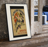Woman dancing with white cat print in a black frame leaning beside a vintage door on parquet
