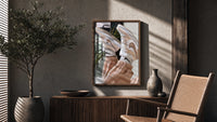 Raised Legs in Beige Sneakers poster framed above a fluted sideboard beside a potted tree