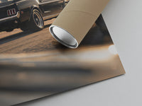 Close-up of the classic black Ford Mustang fastback print with its kraft shipping tube resting on it