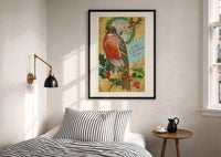 Bird A Merry Christmas to You print in a black frame above a bed with striped linens, a brass wall lamp and a sunlit window