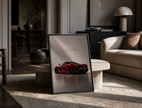 Red Ferrari LaFerrari print on the floor, leaning against a travertine table