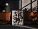 Black-framed Red-Haired Shanks manga collage print on a moody console with designer coffee-table books