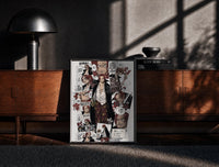 Black-framed Red-Haired Shanks manga collage print on a moody console with designer coffee-table books
