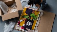 Plant Tote and Red High-Tops framed print being unpacked from protective bubble wrap and a box