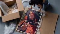 Anime warrior with red eyes framed print being unpacked from protective bubble wrap and a box