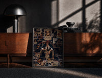 Black-framed Red-haired pirate man sitting print on a moody console with designer coffee-table books