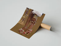 Gently curled Red Platform Heels and Mesh Bag print beside its protective shipping tube