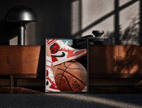Black-framed Red Sneakers on a Basketball print on the floor in front of a dark wooden console