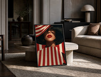 Red Stripes and a Wide Hat print on the floor, leaning against a travertine table