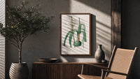 Botanical illustration of flowering bulb plant poster framed above a fluted sideboard beside an olive tree