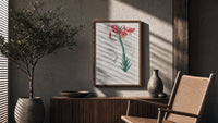 Botanical illustration of pink lily poster framed above a fluted sideboard beside an olive tree