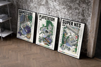 Retro video game console triptych set of three black-framed prints leaning against a raw-plaster wall