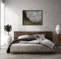 Riverside marina with sailboats print in a dark wood frame above a rattan bed on a plaster wall