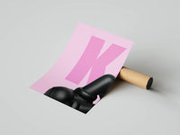 Rolled poster showing black KAWS figure feet and legs on pastel pink with large letter detail