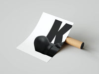 Rolled KAWS poster showing the figure head and shoulders against a large bold white letter