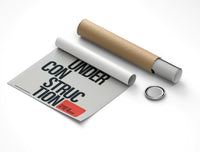 Rolled Under Construction motivational typography poster with cardboard tube packaging