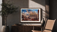 Bank of England and Royal Exchange print in a wood frame above a fluted sideboard beside an olive tree