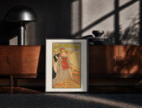 Black-framed woman in red bathing suit at beach print on a moody console with designer coffee-table books