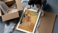 Woman in red bathing suit at beach framed print being unpacked from protective bubble wrap and a box