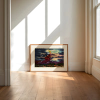 Witch flying on broomstick with cat print in an oak frame on a sunlit wood floor beneath tall window light