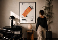 Salmon Lighter Seafood Market print in a black frame on a sunlit plaster wall, a woman looking on beside a mushroom lamp