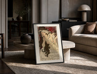 Woman with flowing hair holding feather print in a black frame leaning on a travertine table in a sunlit lounge