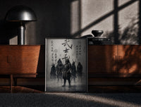 Black-framed Samurai warriors in armor with swords print on a moody console with designer coffee-table books