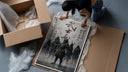 Samurai warriors in armor with swords framed print being unpacked from protective bubble wrap and a box