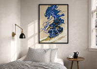 Samurai swordsman print in a black frame above a bed with striped linens, a brass wall lamp and a sunlit window