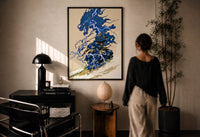 Samurai swordsman print in a black frame on a sunlit plaster wall, a woman looking on beside a mushroom lamp