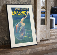 Woman riding a soap bubble print in a black frame leaning beside a vintage door on parquet