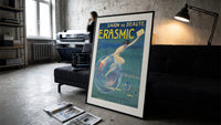 Woman riding a soap bubble print in a slim black frame leaning on a dark sofa in a concrete print studio