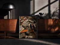 Black-framed Scattered CD Album Cases print on the floor in front of a dark wooden console