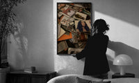 Scattered CD Album Cases print in a slim black frame being hung on a sunlit wall in a monochrome room