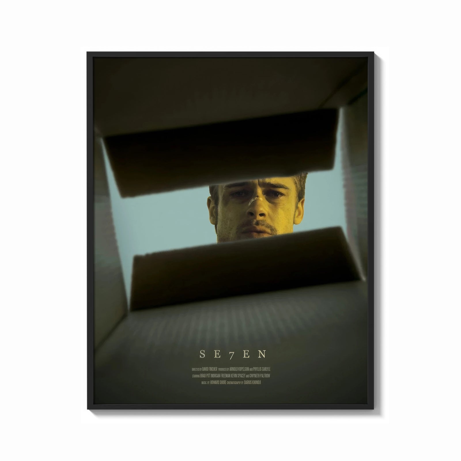 Framed Se7en box scene print shown as a bold statement piece on a clean gallery wall
